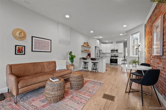 3003 California St, Denver, CO 80205 - living room with light wood-style floors and recessed lighting