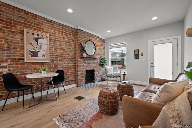 3003 California St, Denver, CO 80205 - living area featuring wood finished floors, a brick fireplace, and recessed lighting