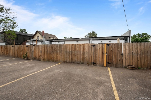 3003 California St, Denver, CO 80205 - uncovered parking lot with a gate