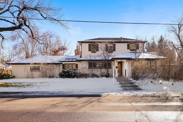 view of front of home featuring solar panels