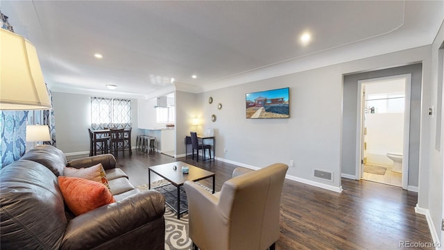 living room with dark hardwood / wood-style flooring