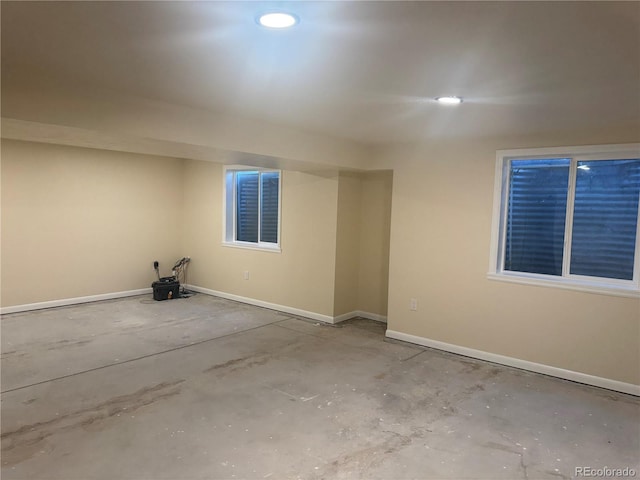 unfurnished room featuring baseboards and recessed lighting