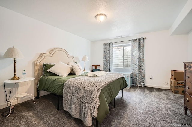 carpeted bedroom with visible vents and baseboards