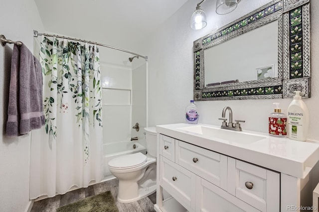 full bath with vanity, toilet, wood finished floors, and shower / bath combo with shower curtain