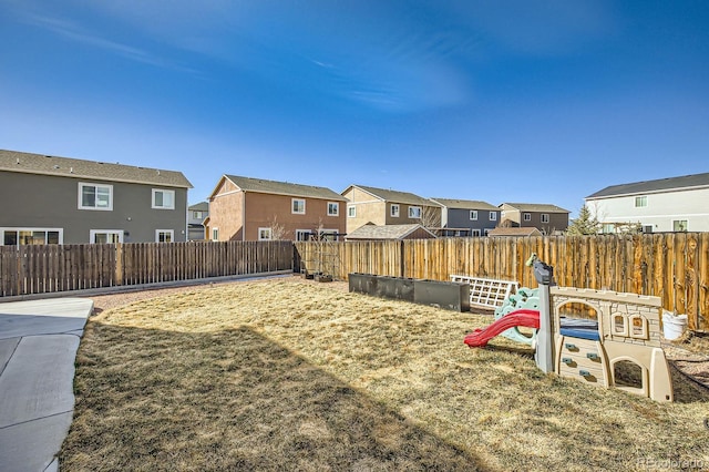 view of yard with a residential view and a fenced backyard