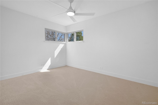 5730 E 19th Ave, Denver, CO 80220 - spare room featuring light carpet, baseboards, and a ceiling fan