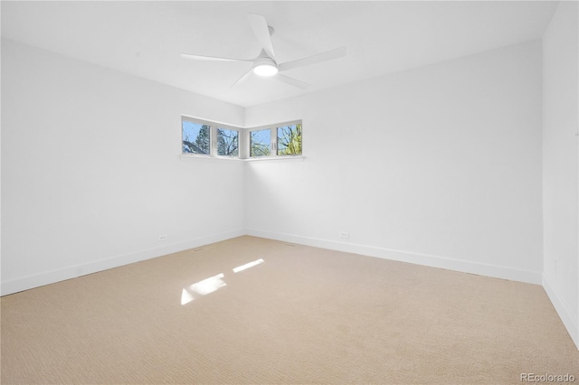 5730 E 19th Ave, Denver, CO 80220 - spare room featuring light colored carpet, a ceiling fan, and baseboards