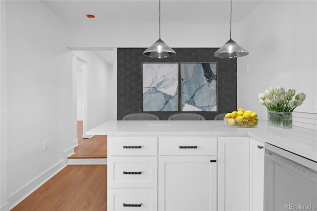 5730 E 19th Ave, Denver, CO 80220 - detailed view of dishwasher, wood finished floors, and baseboards