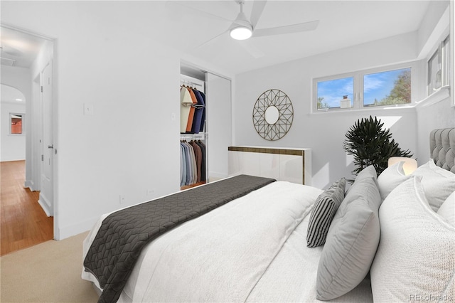 5730 E 19th Ave, Denver, CO 80220 - carpeted bedroom with arched walkways, a closet, a ceiling fan, and baseboards