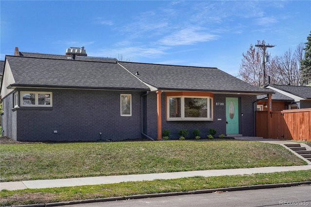 5730 E 19th Ave, Denver, CO 80220 - single story home featuring roof with shingles and brick siding