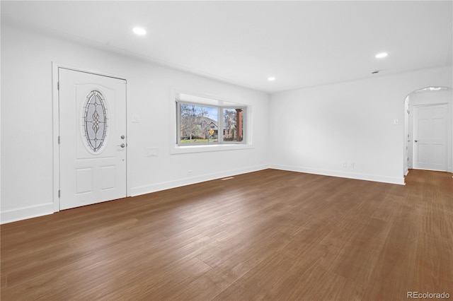 5730 E 19th Ave, Denver, CO 80220 - entryway with arched walkways, wood finished floors, recessed lighting, and baseboards