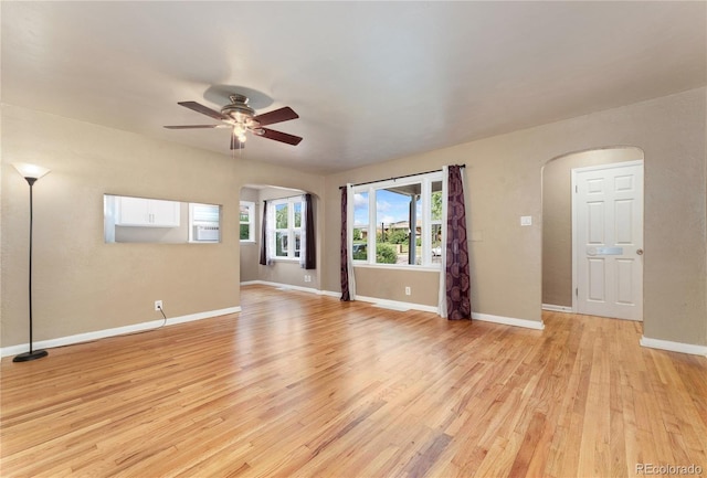 spare room featuring light wood-type flooring and ceiling fan