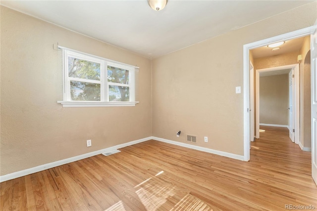 empty room with light wood-type flooring