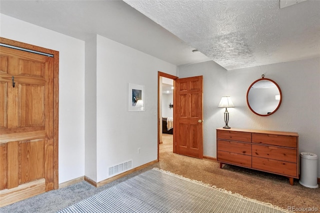 294 Kudu Trl, Bailey, CO 80421 - bedroom with light colored carpet, baseboards, and a textured ceiling