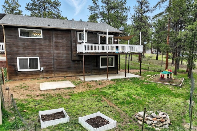 294 Kudu Trl, Bailey, CO 80421 - rear view of property featuring a patio area, a deck, and a vegetable garden