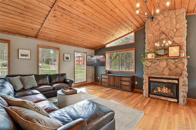 294 Kudu Trl, Bailey, CO 80421 - living area featuring lofted ceiling, a chandelier, wood ceiling, wood finished floors, and baseboards