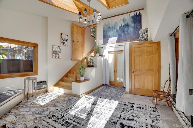 foyer entrance featuring a notable chandelier and baseboard heating