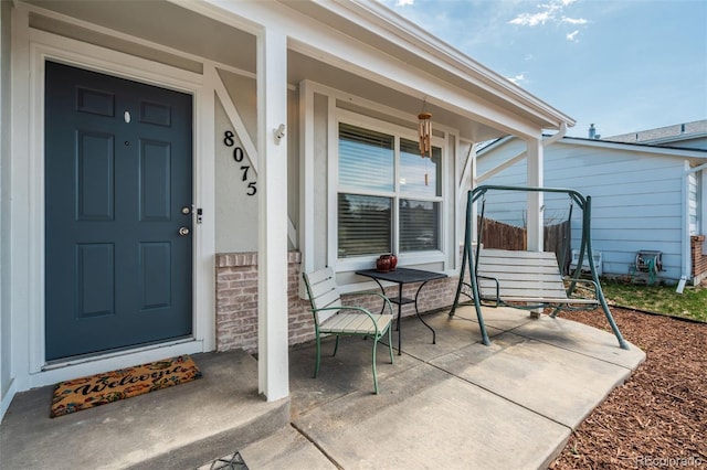 doorway to property featuring a porch