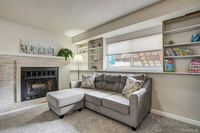 living area with a textured ceiling, carpet flooring, baseboards, and a fireplace