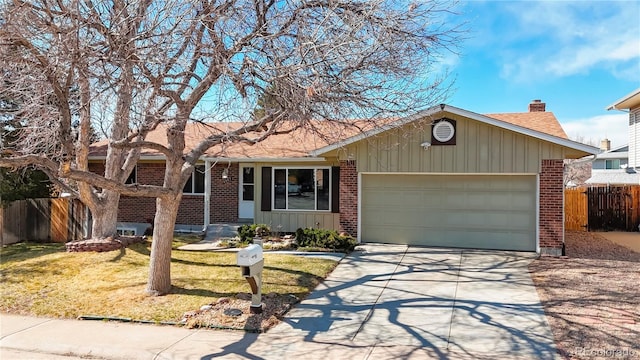 single story home with driveway, a front yard, fence, and brick siding