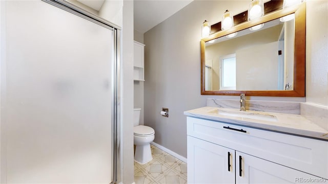 bathroom featuring a stall shower, baseboards, toilet, tile patterned floors, and vanity