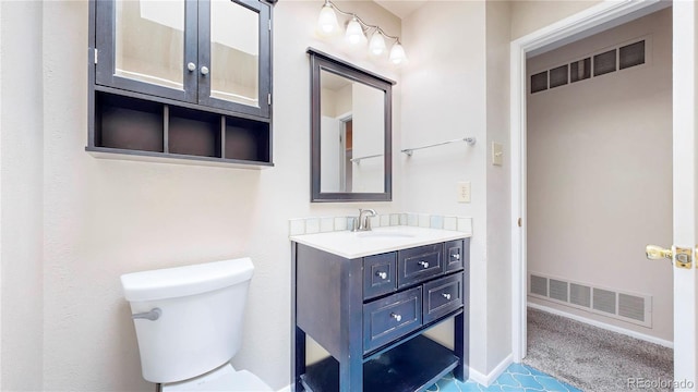 half bathroom with toilet, baseboards, visible vents, and vanity