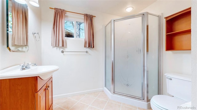 full bathroom featuring toilet, a stall shower, vanity, tile patterned flooring, and baseboards