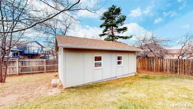 view of outbuilding featuring an outdoor structure and a fenced backyard