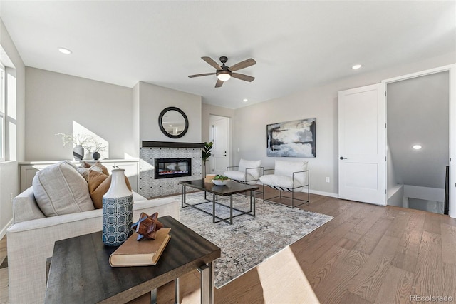 living room featuring ceiling fan and wood-type flooring