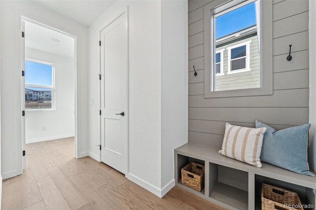 mudroom with light hardwood / wood-style floors