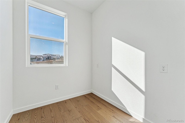 unfurnished room featuring plenty of natural light and light hardwood / wood-style flooring