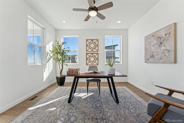 home office featuring ceiling fan and wood-type flooring