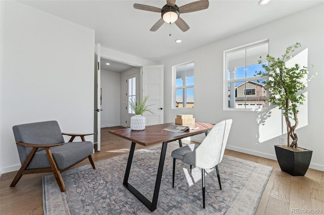 office space with hardwood / wood-style floors and ceiling fan