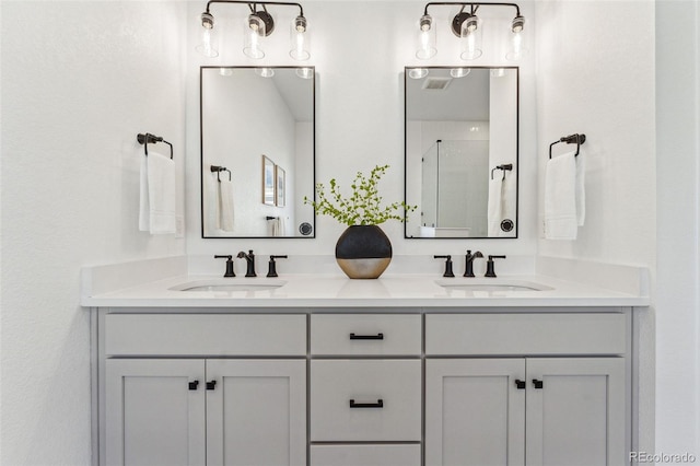 bathroom featuring vanity and an enclosed shower