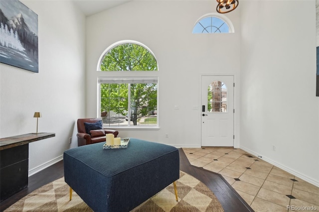 4520 Maroon Cir, Broomfield, CO 80023 - foyer featuring high vaulted ceiling, wood finished floors, and baseboards