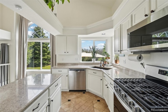 4520 Maroon Cir, Broomfield, CO 80023 - kitchen featuring stainless steel appliances, a sink, and plenty of natural light