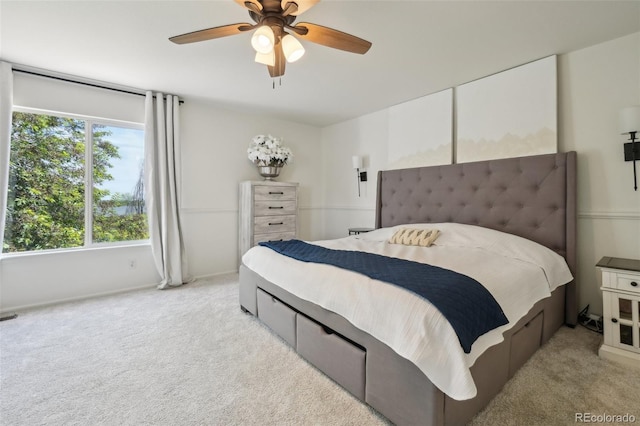 4520 Maroon Cir, Broomfield, CO 80023 - bedroom with light colored carpet, ceiling fan, and baseboards