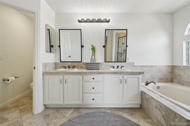 4520 Maroon Cir, Broomfield, CO 80023 - full bathroom featuring a shower stall, toilet, a garden tub, and double vanity