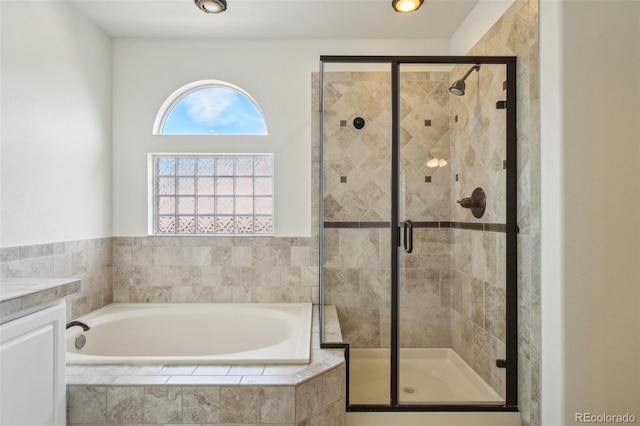 4520 Maroon Cir, Broomfield, CO 80023 - bathroom featuring a bath, a stall shower, and vanity