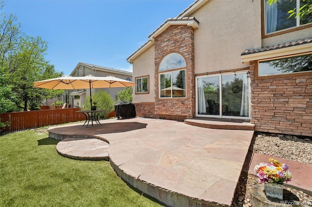 4520 Maroon Cir, Broomfield, CO 80023 - rear view of house with a patio area, stucco siding, and stone siding
