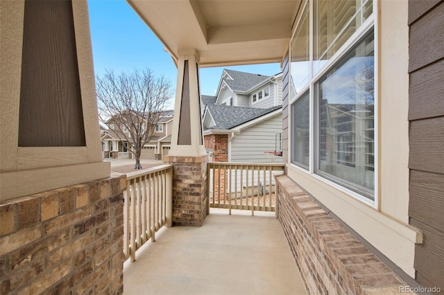 view of patio / terrace featuring a porch and a residential view