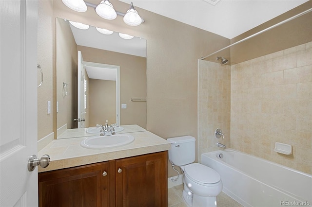 bathroom with shower / bath combination, vanity, toilet, and tile patterned floors