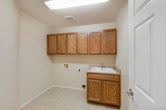 laundry area with hookup for a washing machine, visible vents, cabinet space, a sink, and electric dryer hookup