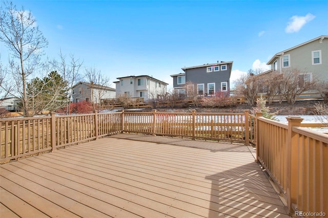 wooden deck with a residential view