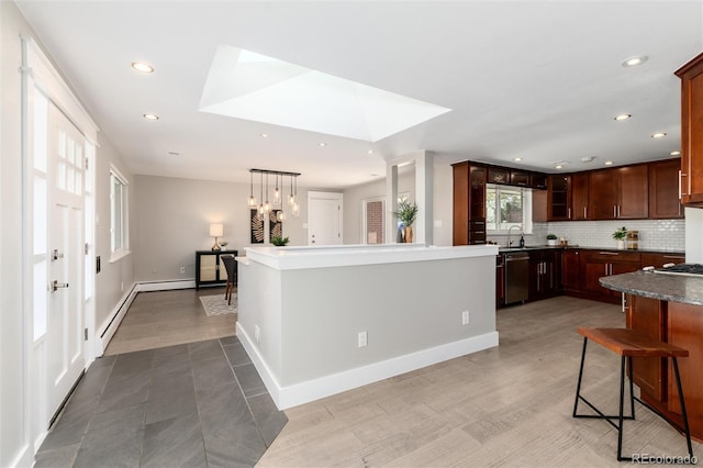 5743 Field St, Arvada, CO 80002 - kitchen featuring stainless steel dishwasher, backsplash, recessed lighting, baseboard heating, and glass insert cabinets