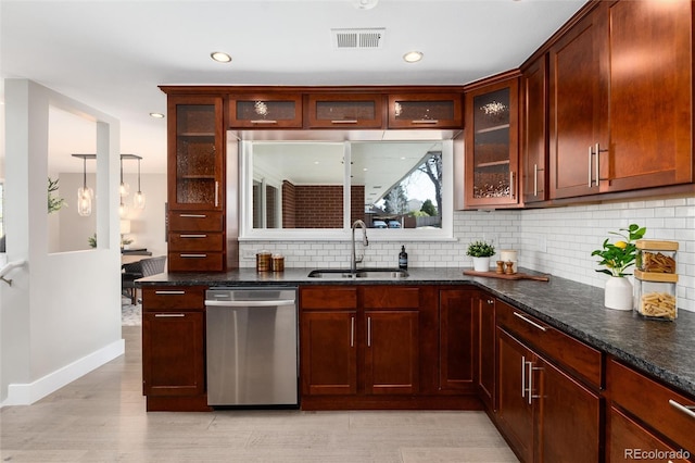 5743 Field St, Arvada, CO 80002 - kitchen with stainless steel dishwasher, a sink, backsplash, glass insert cabinets, and recessed lighting