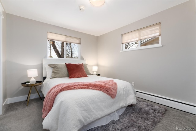 5743 Field St, Arvada, CO 80002 - bedroom featuring carpet flooring, multiple windows, a baseboard heating unit, and baseboards