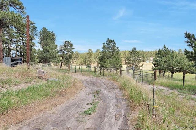 10771 Winding Meadow Dr, Kiowa, CO 80117 - view of street with a gated entry, an exterior structure, and a rural view