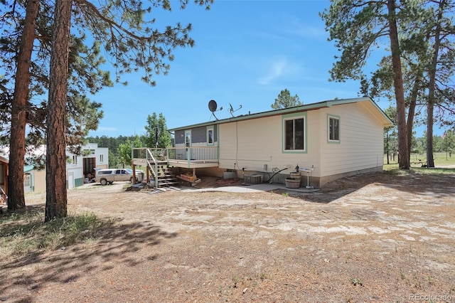 10771 Winding Meadow Dr, Kiowa, CO 80117 - rear view of house featuring a wooden deck