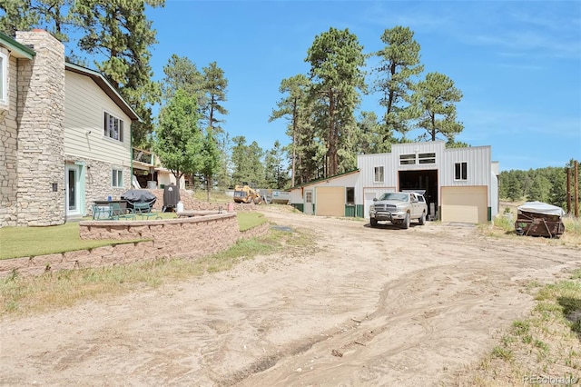 10771 Winding Meadow Dr, Kiowa, CO 80117 - view of yard featuring a garage